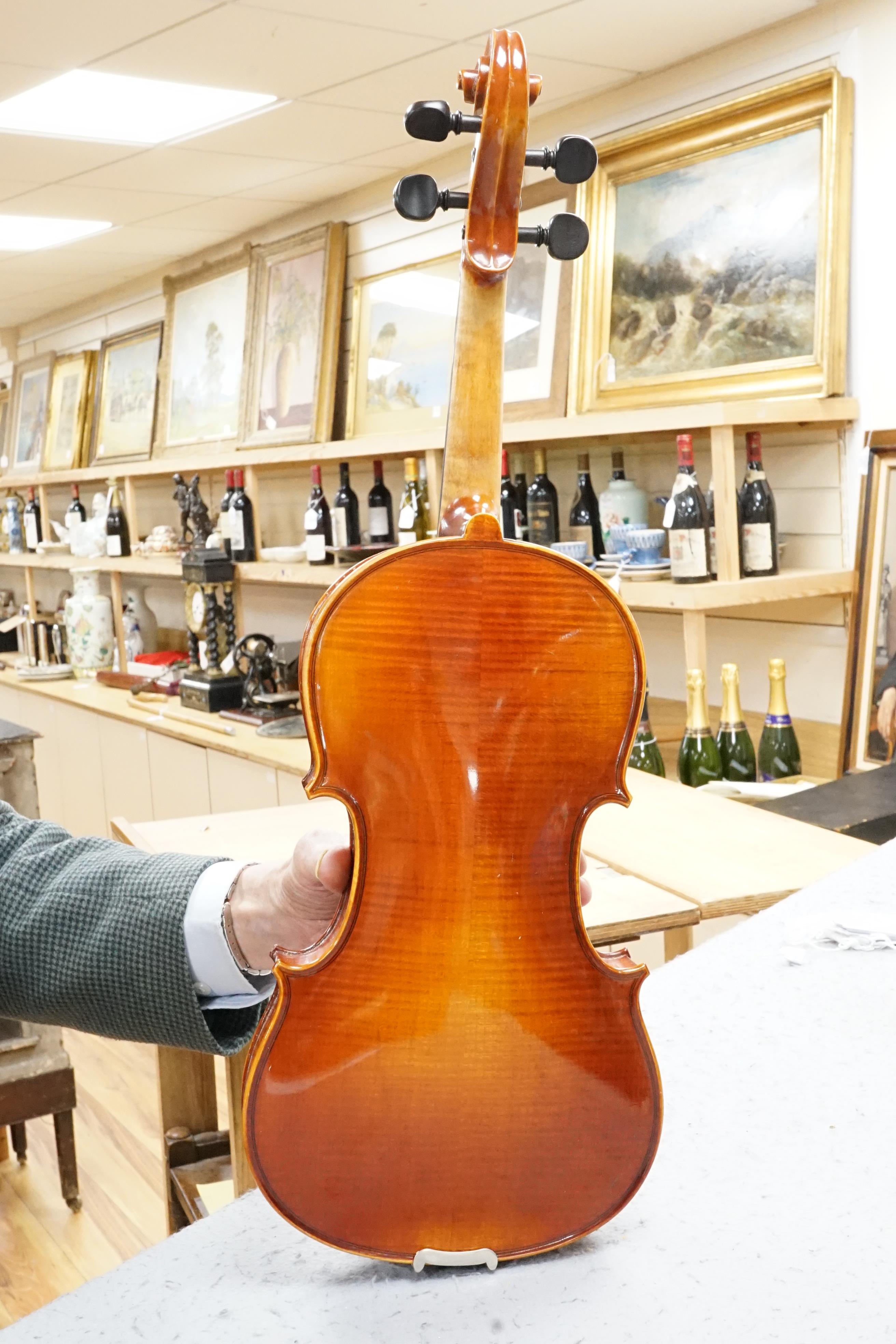 A violin, in fitted case (German)